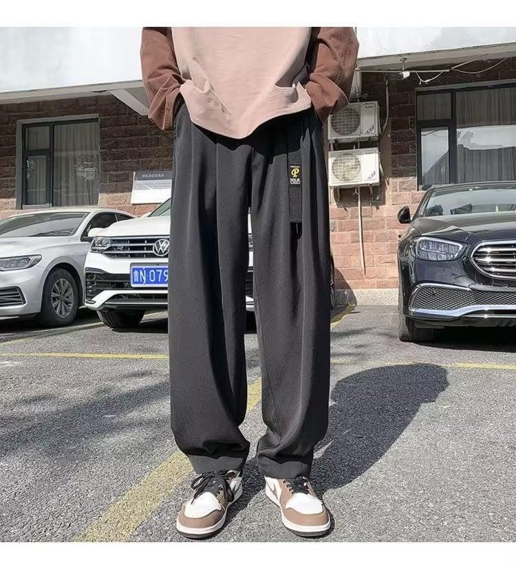 Men's black loose straight wide leg track pants made of lightweight polyester, featuring a solid design for casual and relaxed wear.