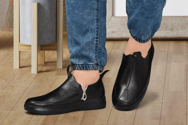 Black men's casual slip-on shoes with synthetic upper and rubber sole.