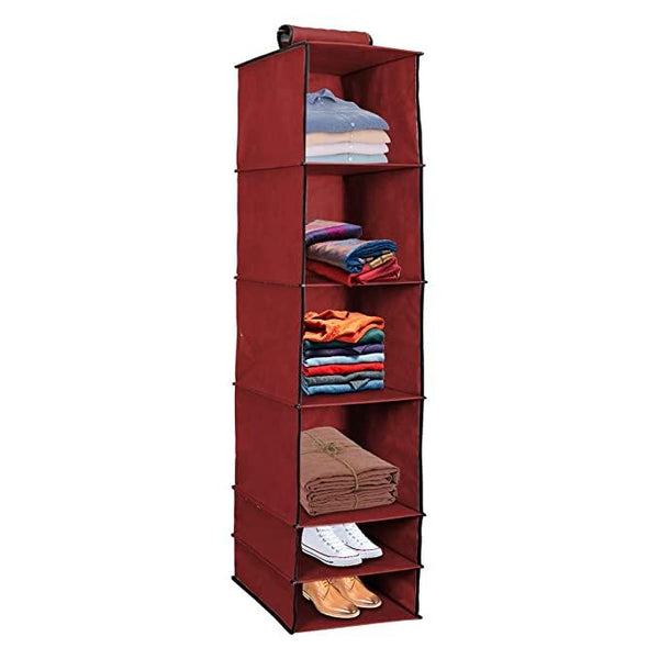  Maximize your closet space with our 6 Shelves Foldable Hanging Wardrobe Organizer in maroon. Made from durable, breathable fabric, this stylish organizer features six spacious shelves for clothes, accessories, and more. Ideal for small spaces and easy to store when not in use. Shop now for a clutter free, elegant wardrobe solution!