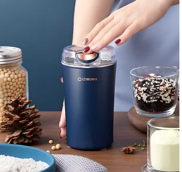 "Compact electric coffee grinder with plastic and steel design, perfect for grinding coffee beans and spices."

