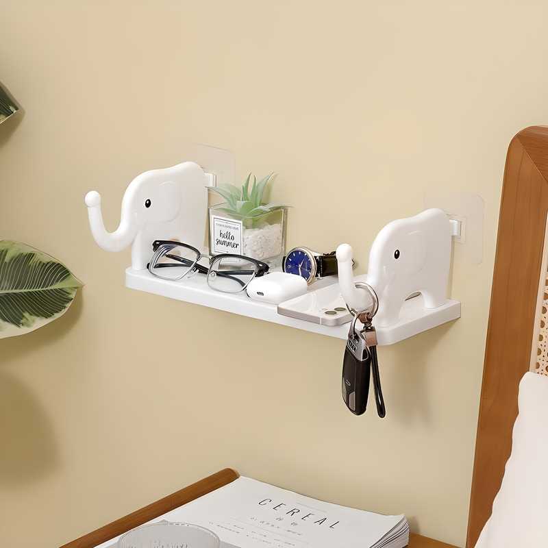 Pack of 2 elephant-shaped self-adhesive floating wall shelves made of durable plastic for kitchens and bathrooms, easy to install with no drilling required.