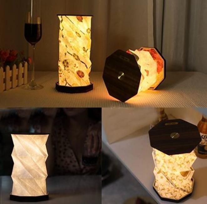 Creative rotating smart touch portable night light made with ABS material, compact and stylish for bedrooms and home décor.