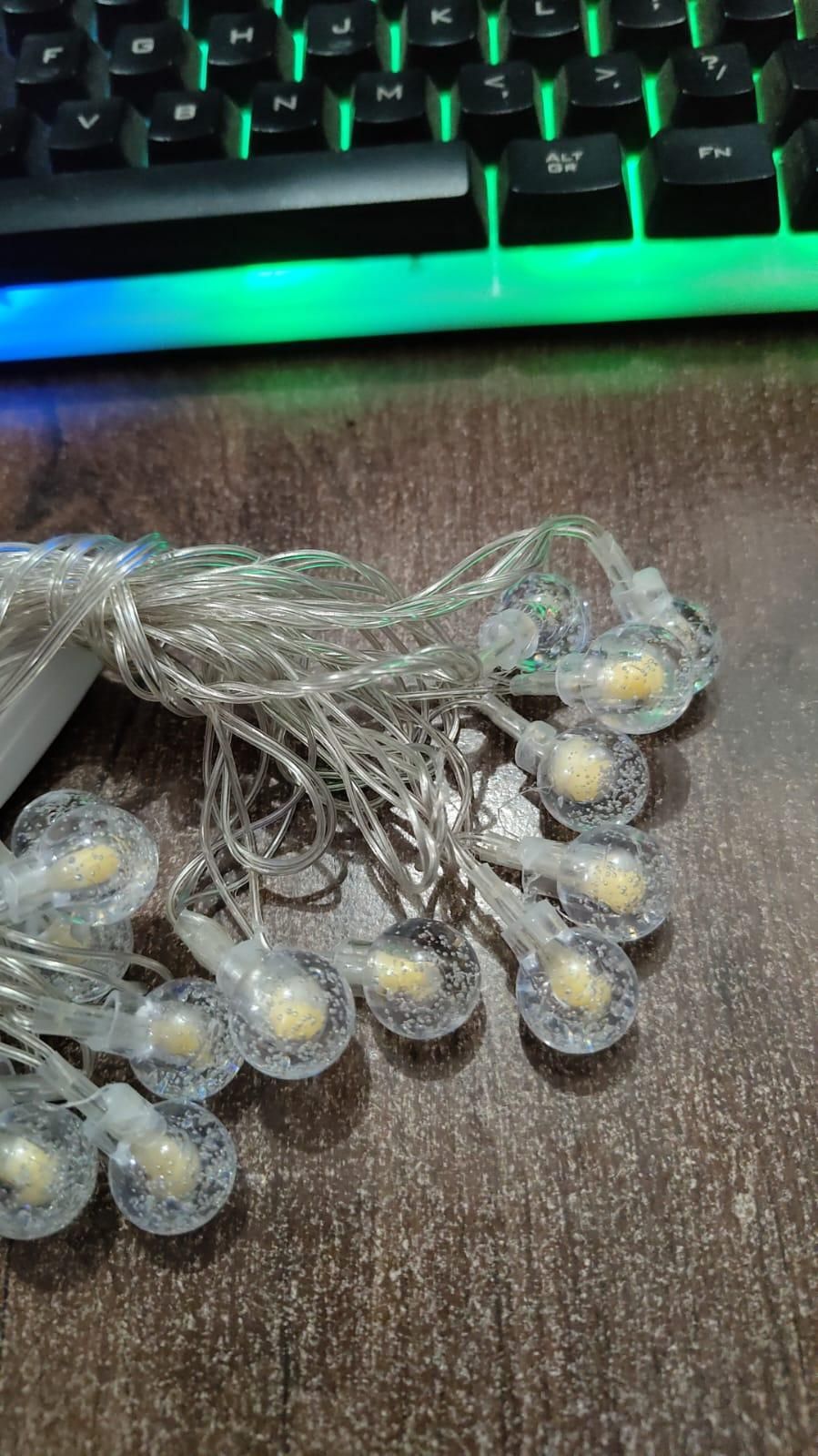 Warm yellow 16 LED crystal balls string light, 3.5m length, perfect for festive and home decorations.

