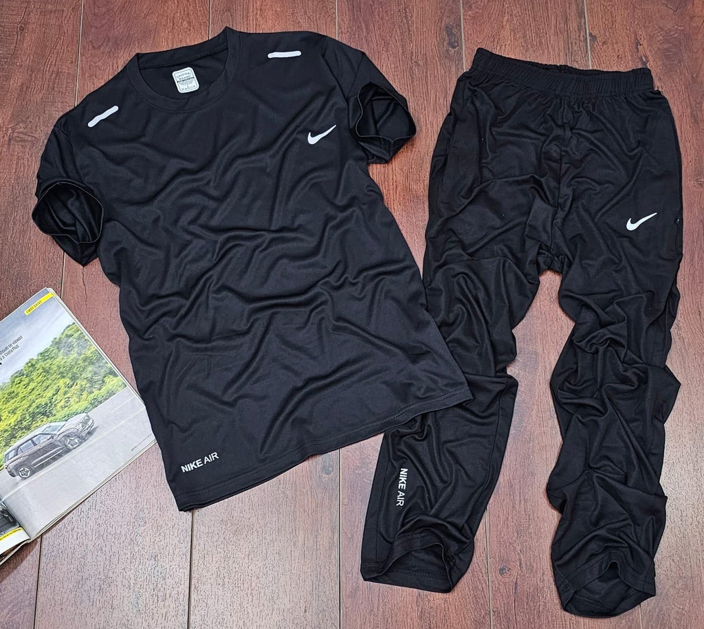 Black men's solid polyester track suit with half sleeves and round neck t-shirt, paired with matching track pants.