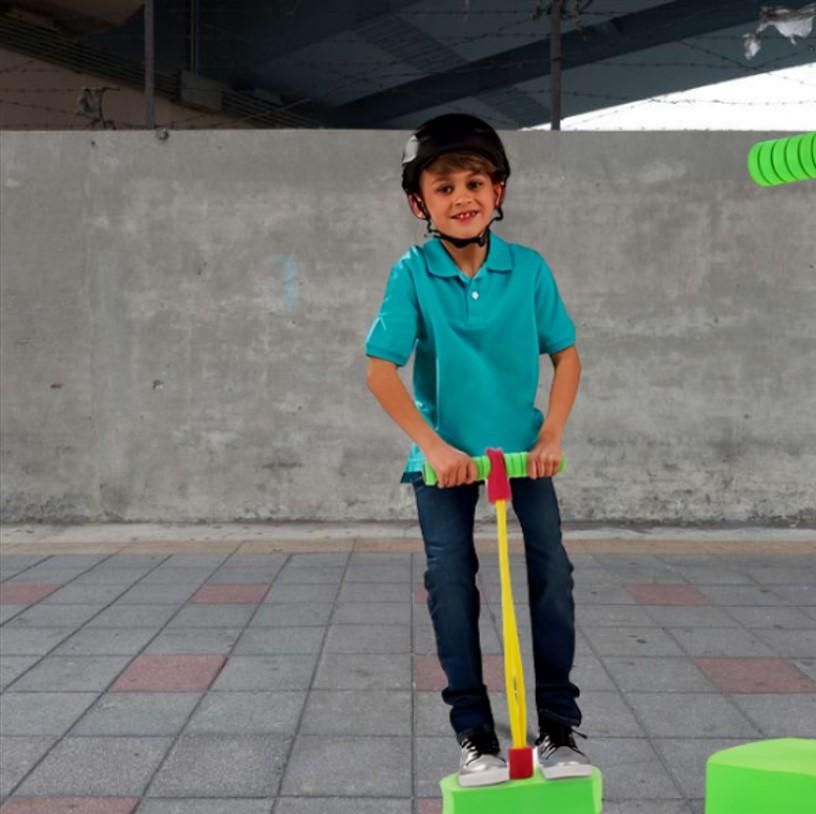 Child playing with a Foam Pogo Jumper, a fun and safe jumping stick with sturdy foam base and comfortable handles, perfect for active play.