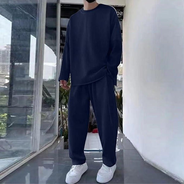 Men's solid navy blue co-ord set with a loose-fit round neck full-sleeve T-shirt and matching track pants, ideal for casual wear.