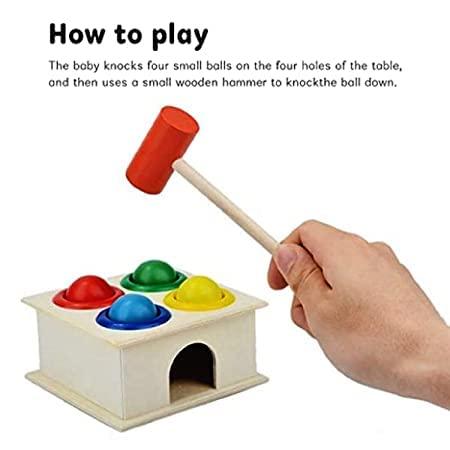 For playing the hammer the baby wil knock the four small balls on te walls of the table,by using wooden hammer to knockle the ball down.