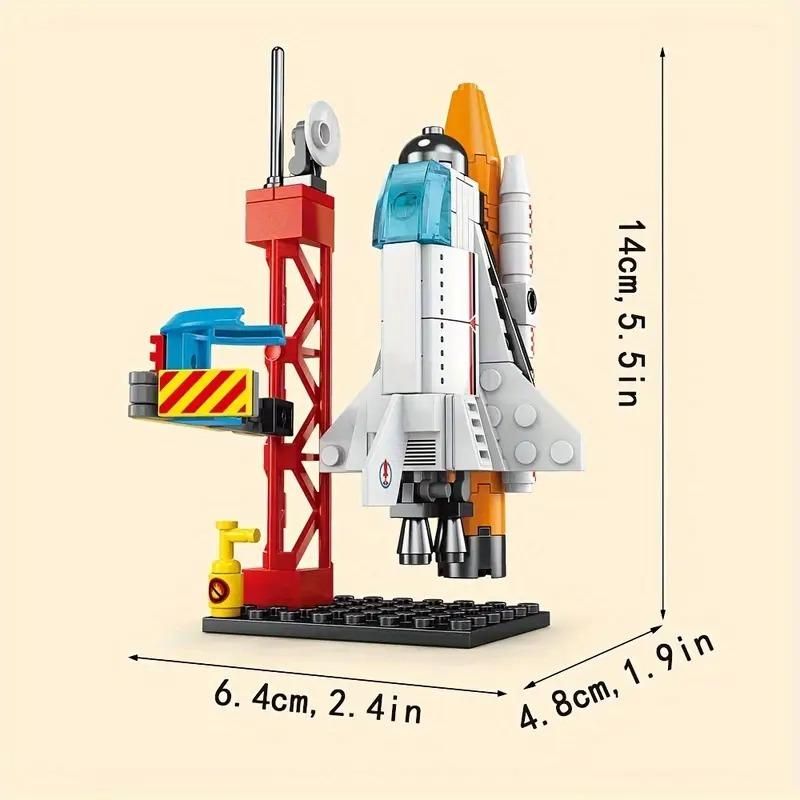 A toy space shuttle launchpad made of interlocking blocks, with dimensions labeled as 14 cm tall, 6.4 cm wide, and 4.8 cm deep.