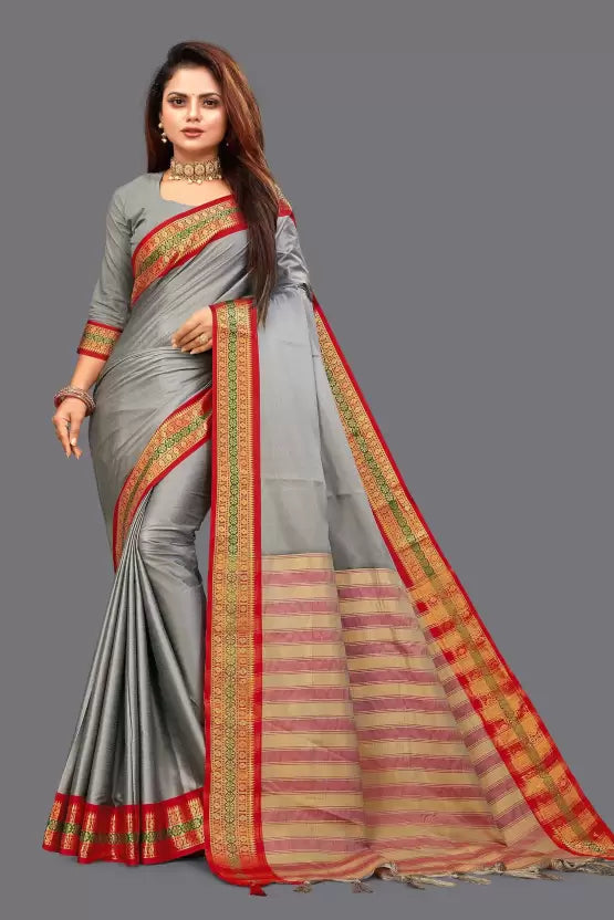 Beautiful Aura Silk Solid Saree featuring luxurious solid-colored fabric with an elegant shimmering zari border. The saree is 6.5 meters in length and includes an unstitched matching blouse piece. Ideal for weddings, festivals, and special occasions, offering a blend of traditional craftsmanship and modern sophistication.