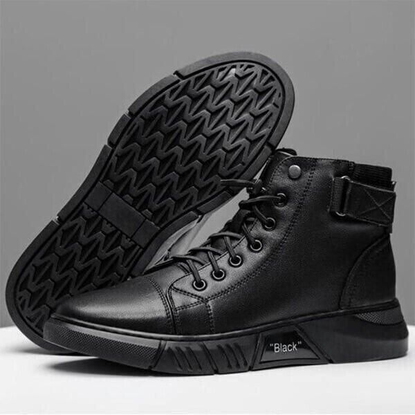 A pair of black high-top sneakers with textured soles and the word 'Black' printed on the side.