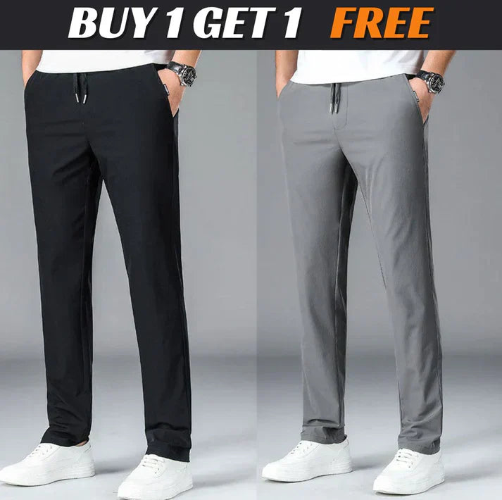 Two men wearing casual drawstring pants, one in black and one in gray, with white sneakers. Text above reads 'BUY 1 GET 1 FREE.'